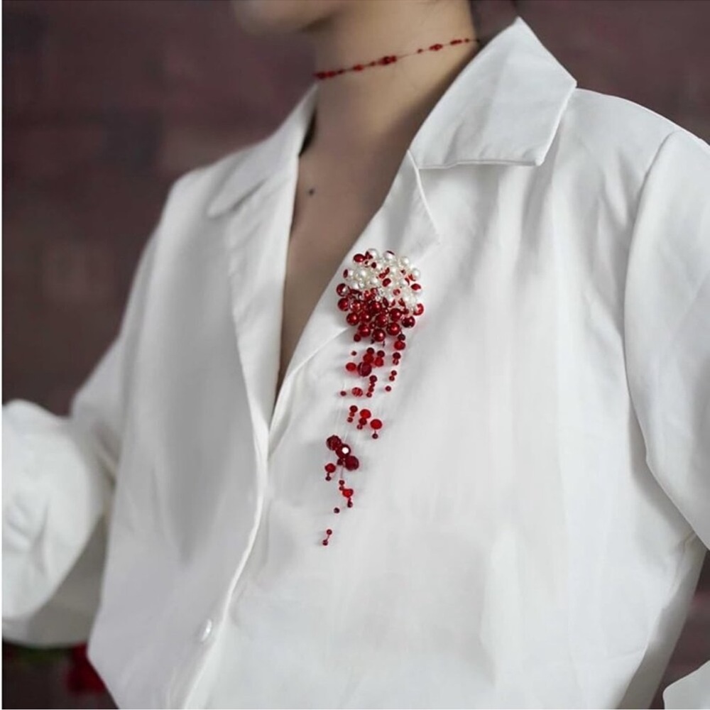Blood pearl brooch
